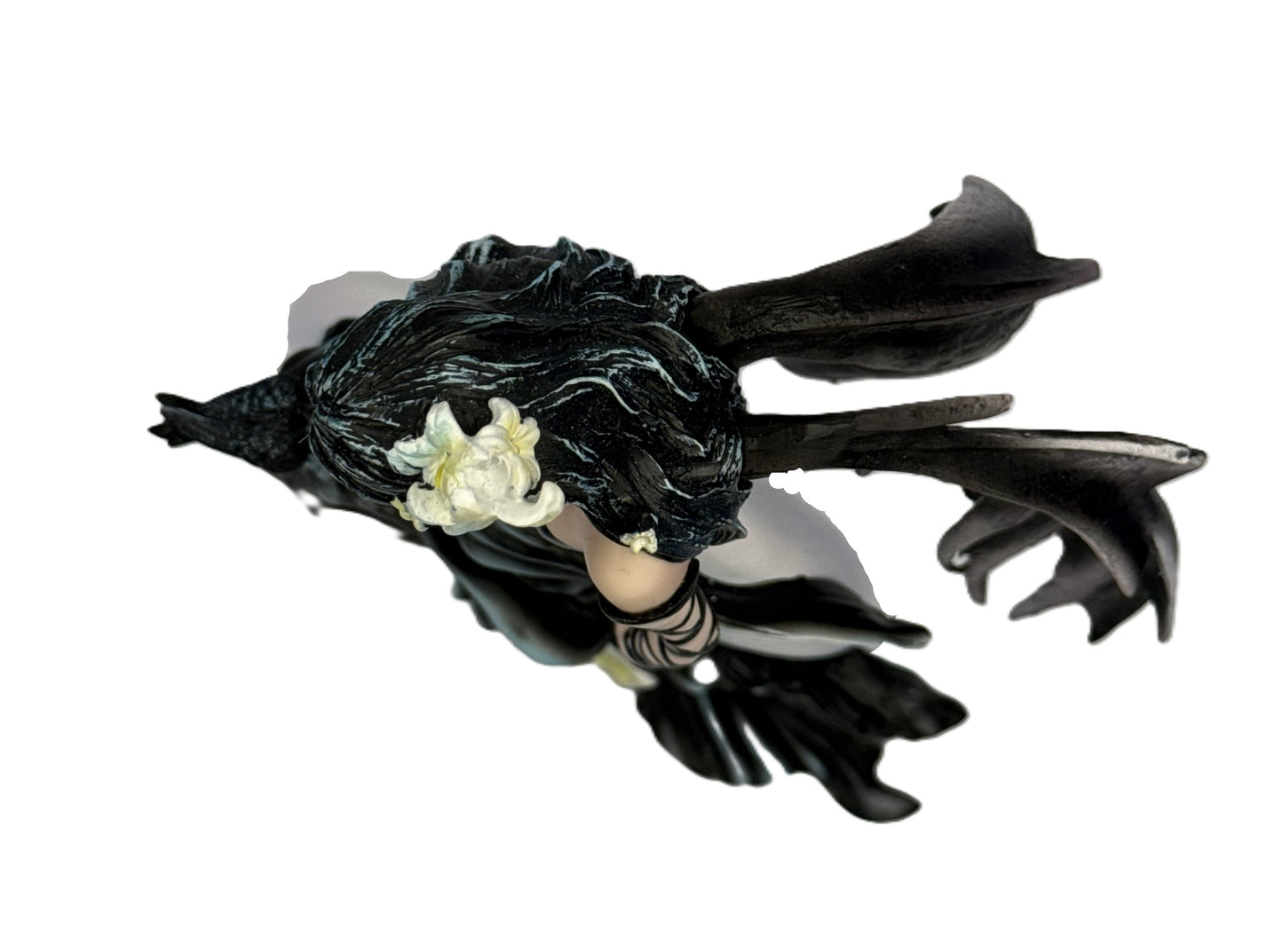 Top view of gothic fairy statue showing hair detail, wings, and floral accents