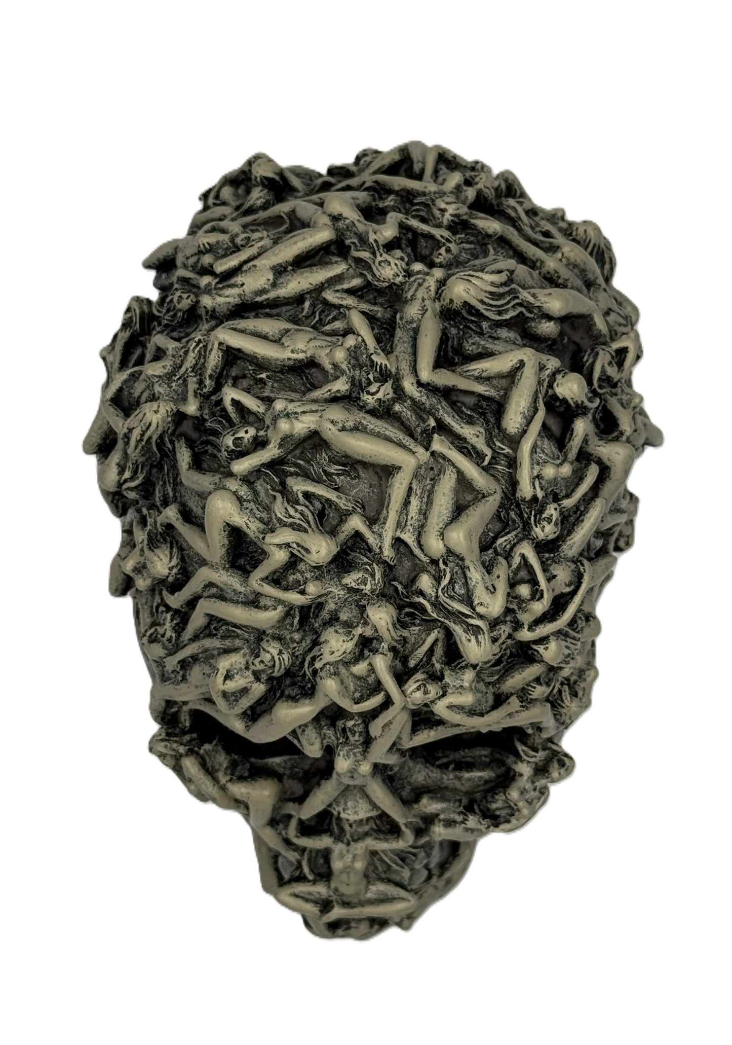 Overhead close view of gothic skull sculpture highlighting tightly packed intertwined human forms