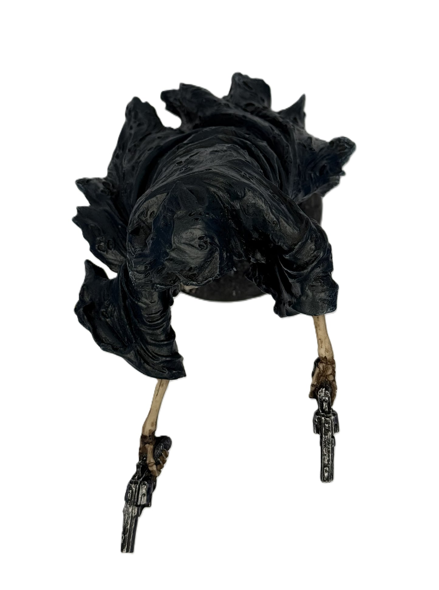 Top view of grim reaper statue emphasizing hooded cloak shape and extended skeletal arms holding revolvers