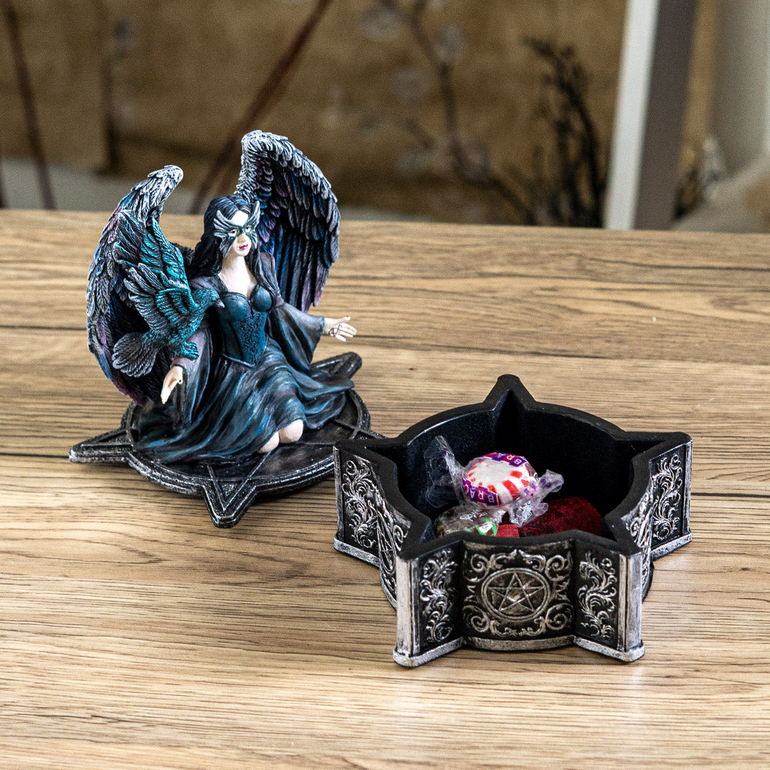 Open raven fairy trinket box displaying storage compartment with decorative base