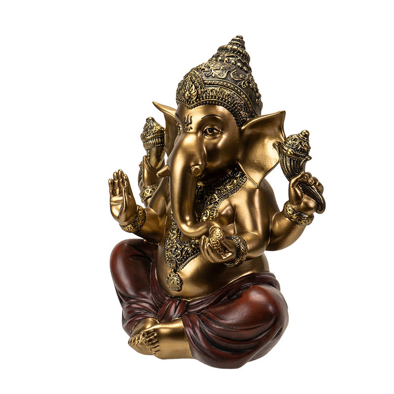 Side view of Hindu Ganesha statue showing posture and decorative elements