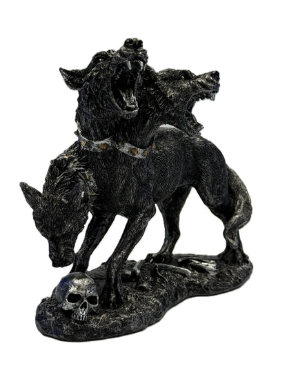 Front view of Cerberus three headed dog statue with snarling heads skull base and gothic cold cast resin detailing
