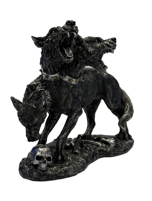 Front view of Cerberus three headed dog statue with snarling heads skull base and gothic cold cast resin detailing
