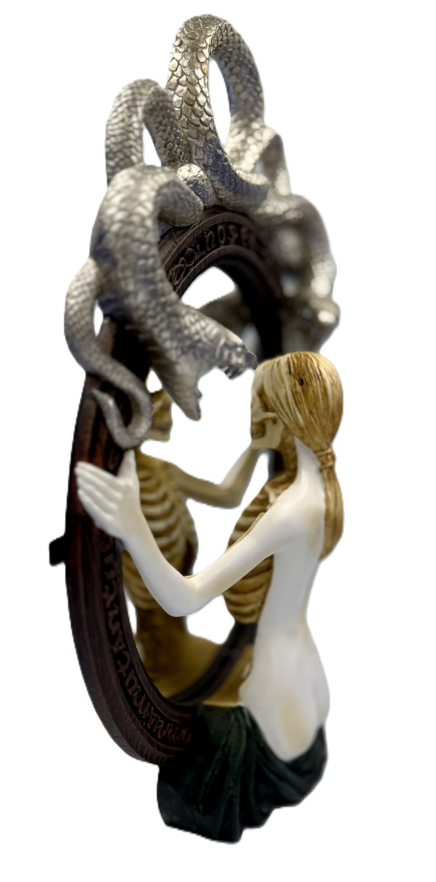 Angled side view showing depth of sculpted serpent frame and mirror design
