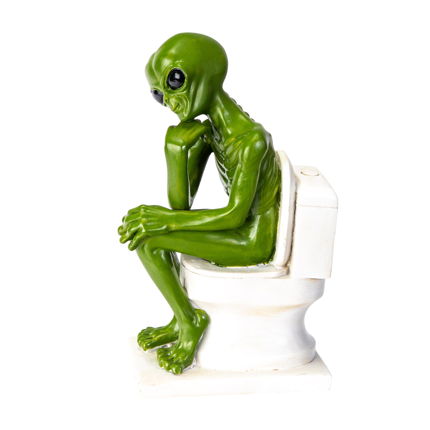Side view of green alien sitting on toilet in thinking pose

