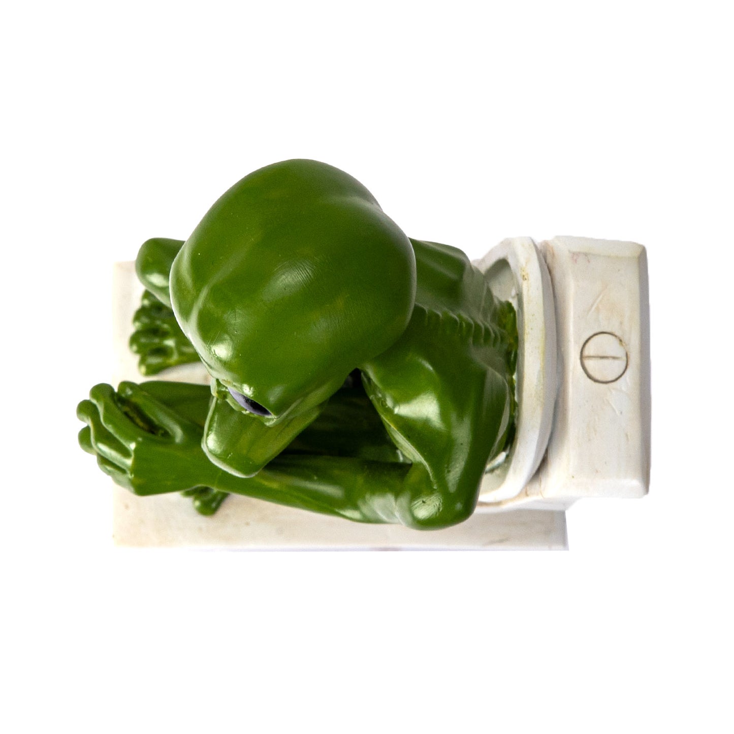 Top view of alien head and posture while sitting on toilet
