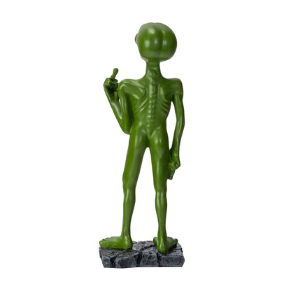 Back view of alien statue showing body structure and base
