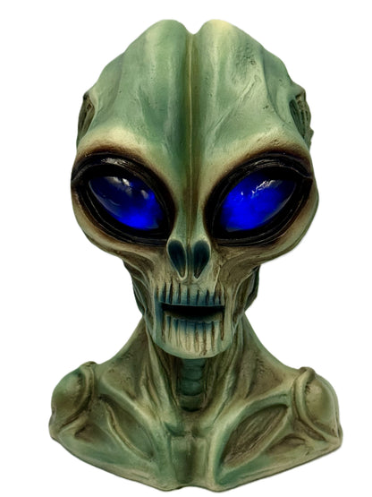 Alien statue with glowing blue LED eyes creating a futuristic effect
