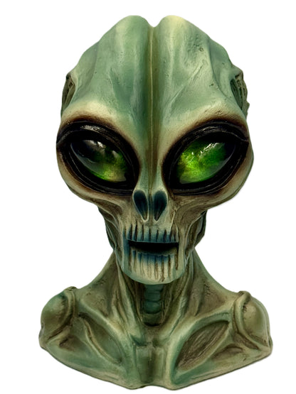 Green LED eye glow illuminating alien face for sci-fi ambiance
