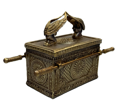 Side view of Ark of the Covenant trinket box with carrying rods and engraved patterns
