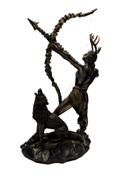 Rear angled view of Artemis statue showing detailed bow, flowing garments, and wolf figure on base
