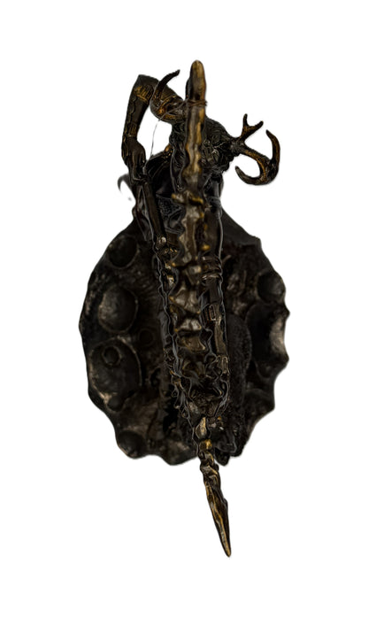 Top down view of Artemis statue showing full composition of bow, figure, and textured base
