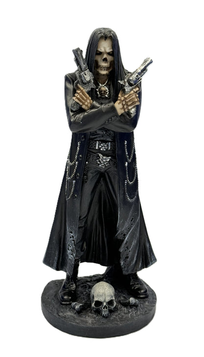 Front view of assassin grim reaper statue holding dual pistols with skull base gothic resin figure
