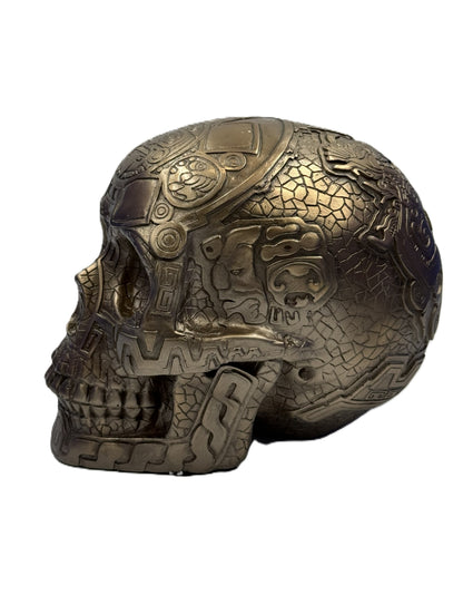 Side view of Aztec skull decor showing detailed carvings and cold cast bronze texture
