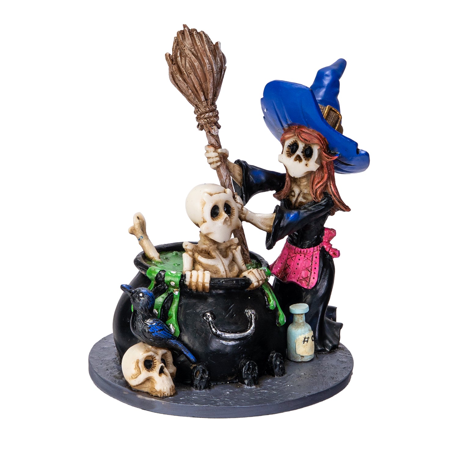 Left angle view of witch and skeleton cauldron figurine with crow and skull details
