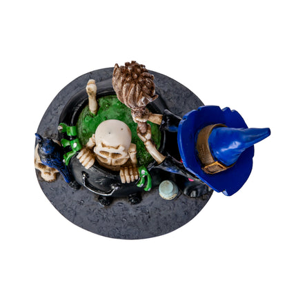 Top view of skeleton in bubbling cauldron with witch stirring potion
