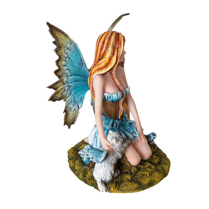 Side view of fairy statue with cat showing wing shape and dress details

