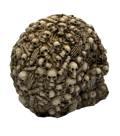 Rear angled view of boneyard skull collectible with intricate bone textures and layered skull formations
