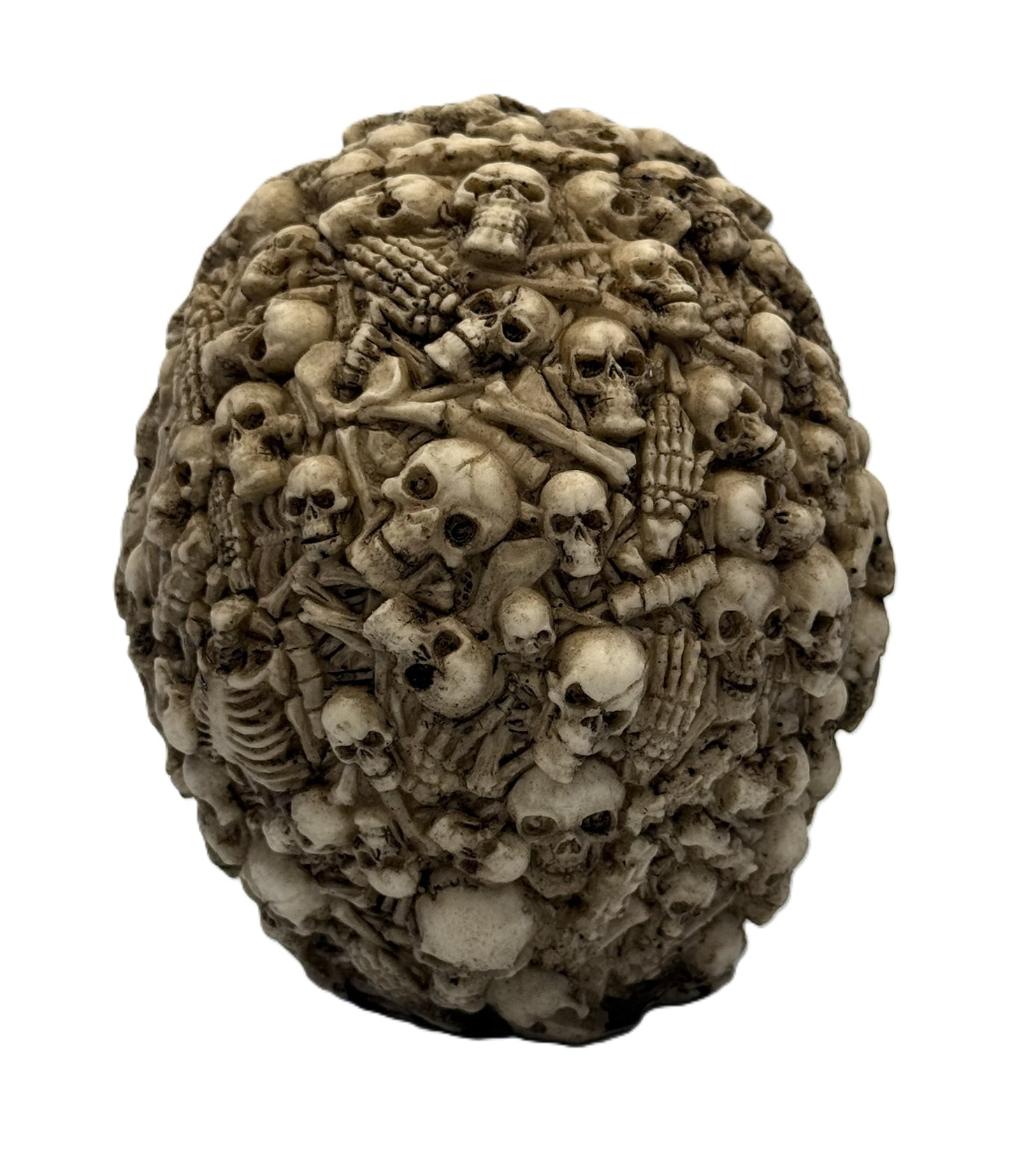 Rear view of multi skull statue showing dense arrangement of bones and skulls in textured gothic design
