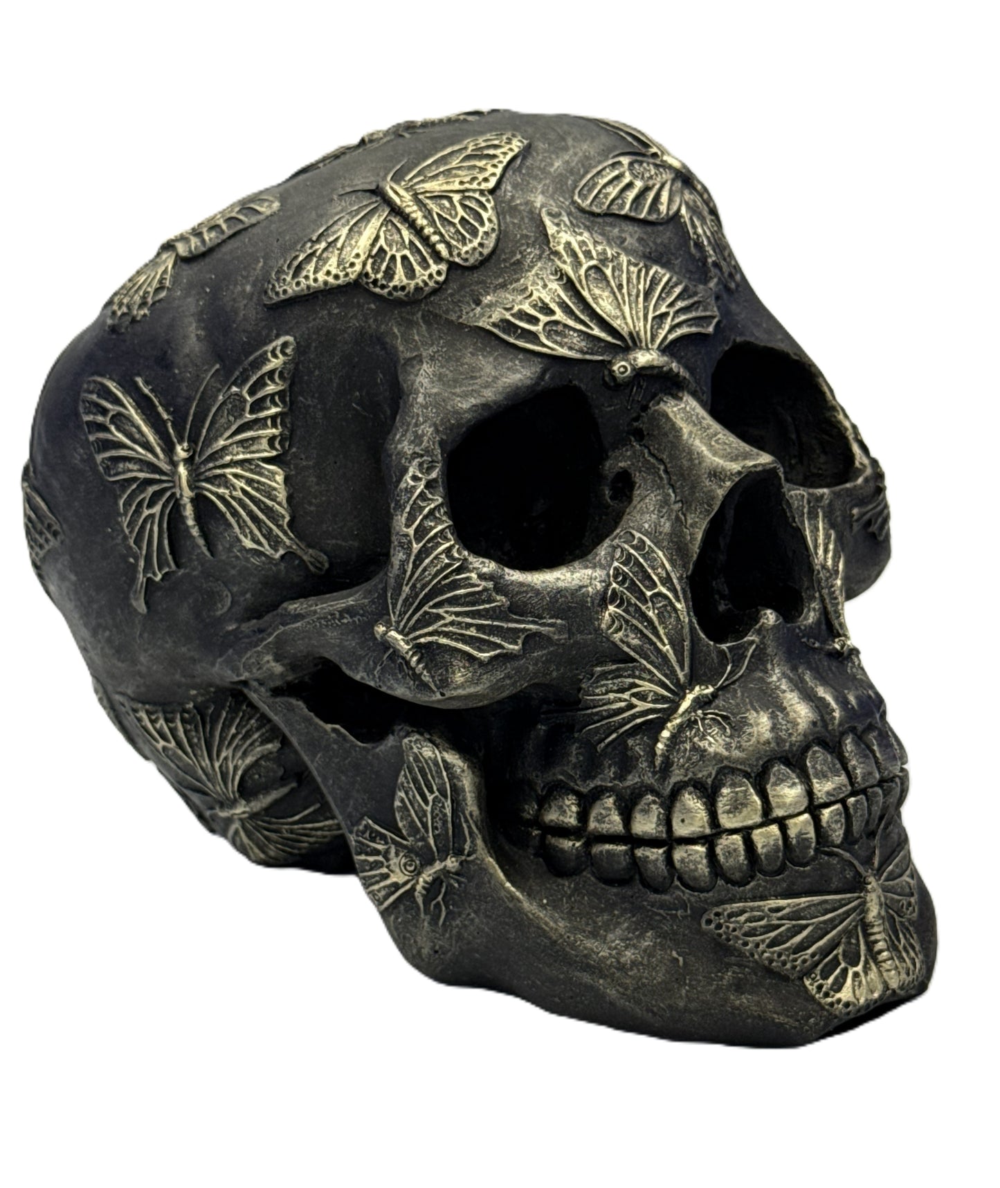 Front right angled view of gothic skull statue with butterflies emphasizing detailed craftsmanship
