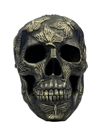 Front view of gothic butterfly skull resin statue with detailed butterflies covering the skull surface
