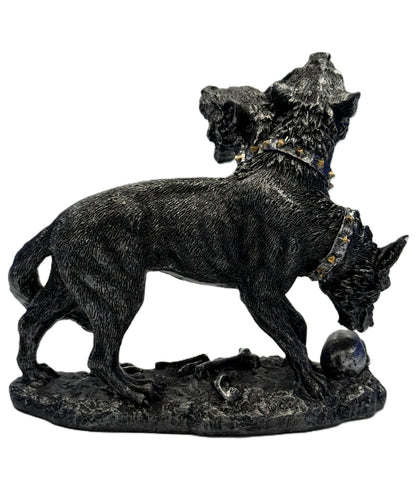 Right side view of Cerberus statue with lowered head skull base and textured ground detail in resin
