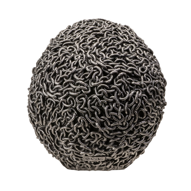 Back view of chain skull statue showing full chain texture wrapping the skull
