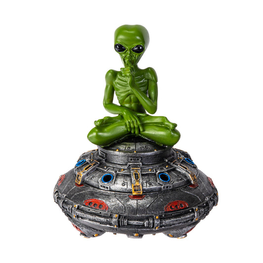 Front view of green alien meditating on UFO incense burner
