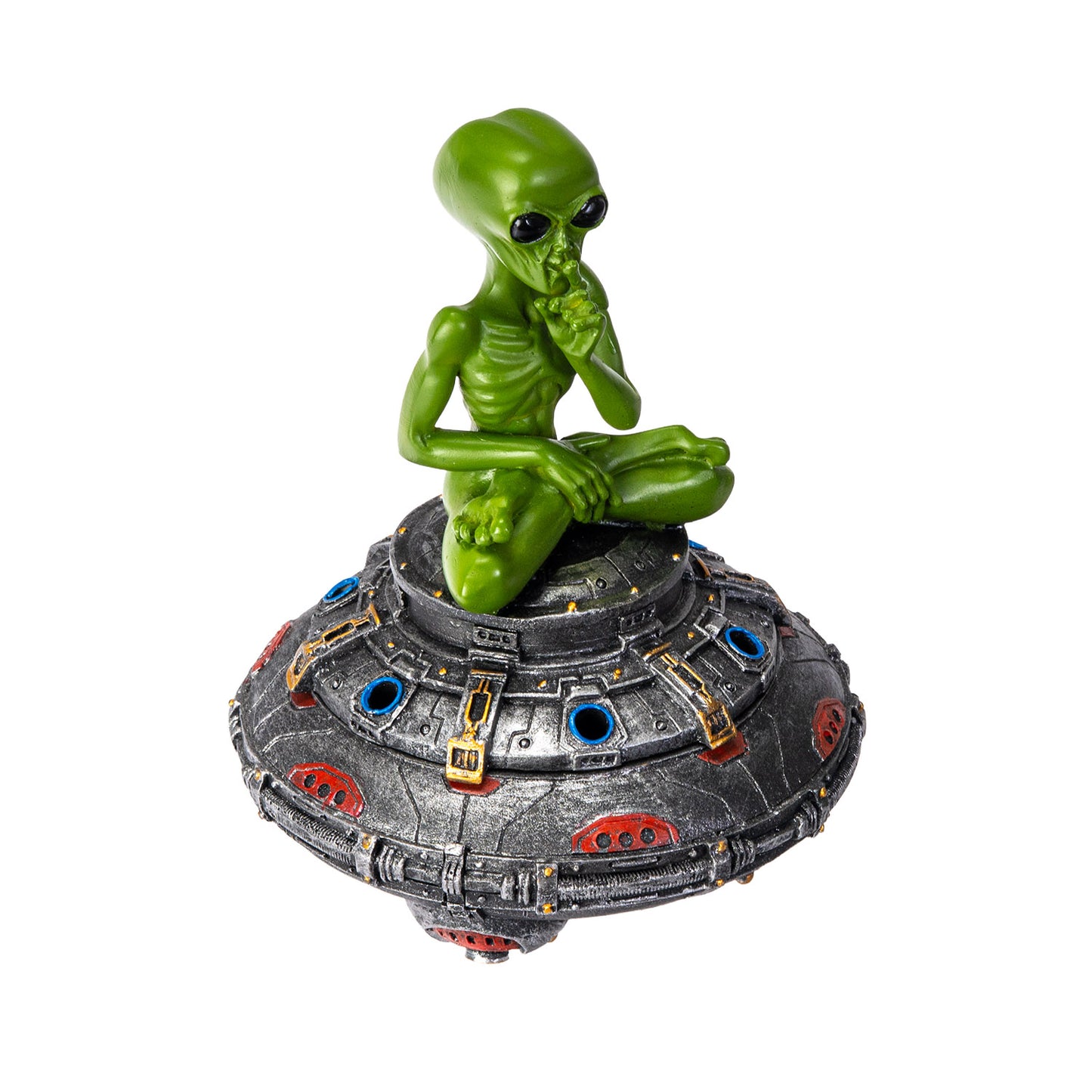 Side angle view of alien sitting cross legged on UFO burner
