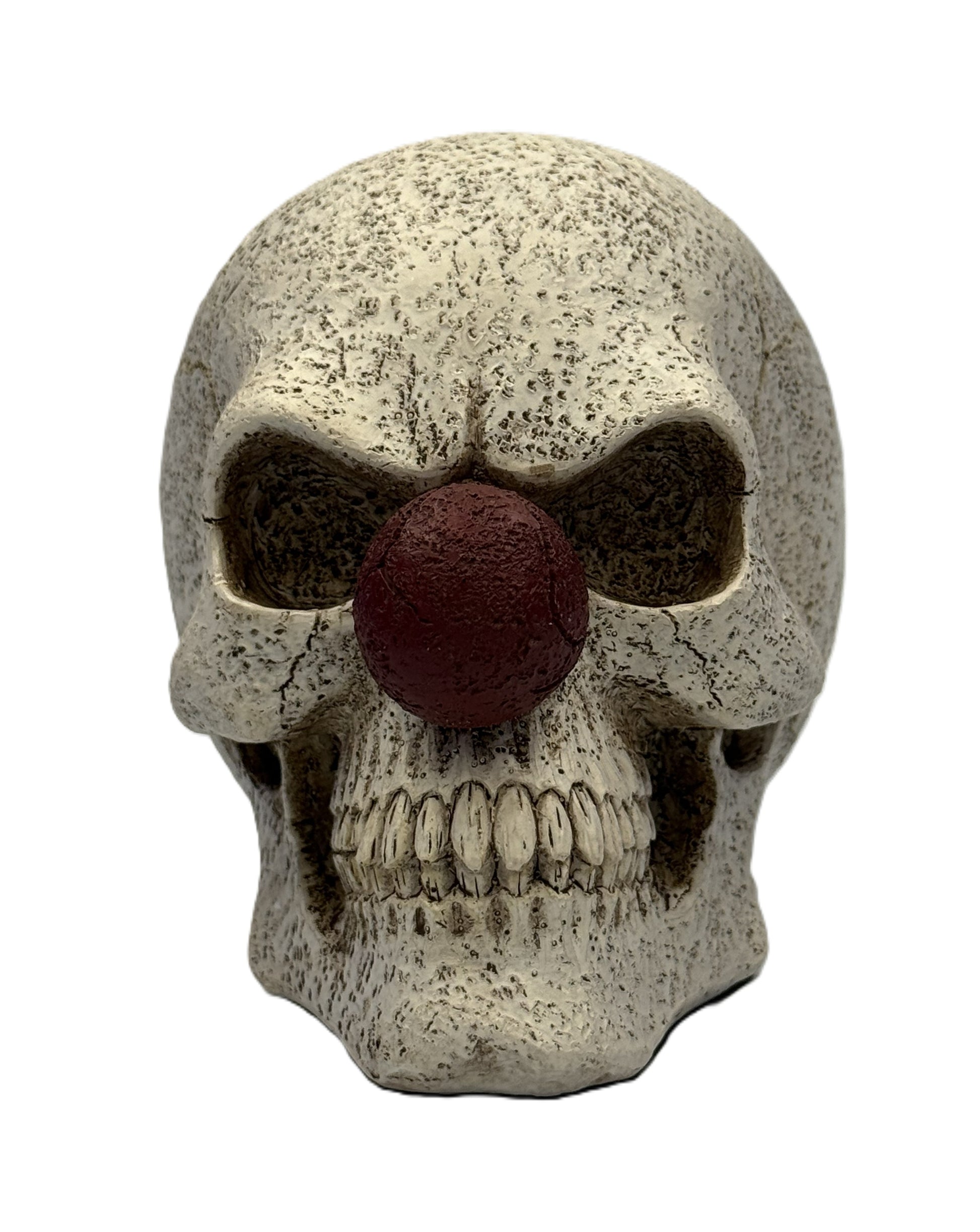 Front view of clown skull figurine with red nose hollow eyes detailed teeth and cracked gothic design
