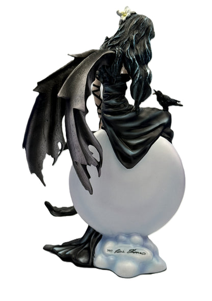 Rear angled view of gothic angel figurine showing wing details and elegant dress draping over orb
