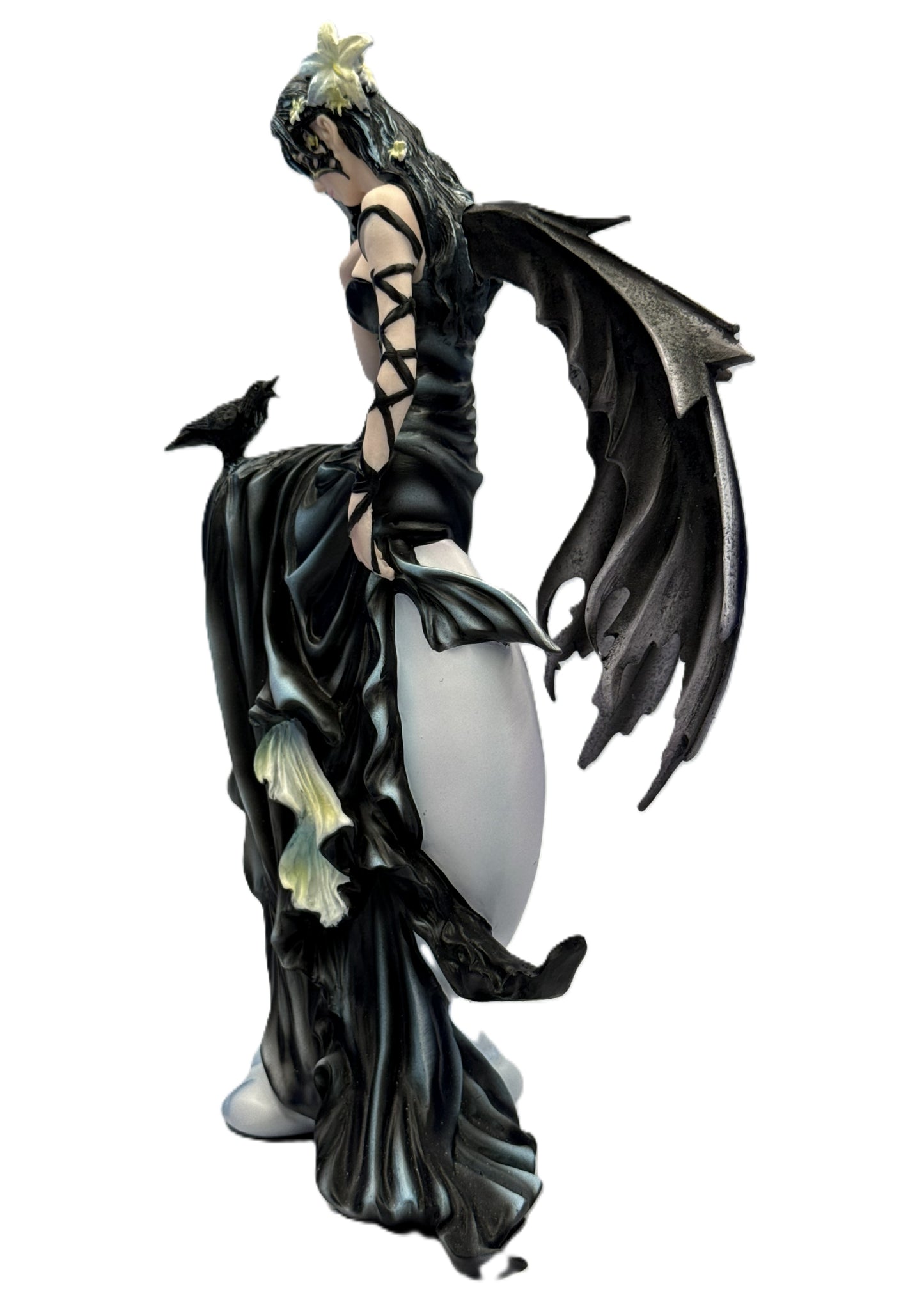 Left side view of gothic fairy statue showing detailed wings, flowing dress, and perched raven companion
