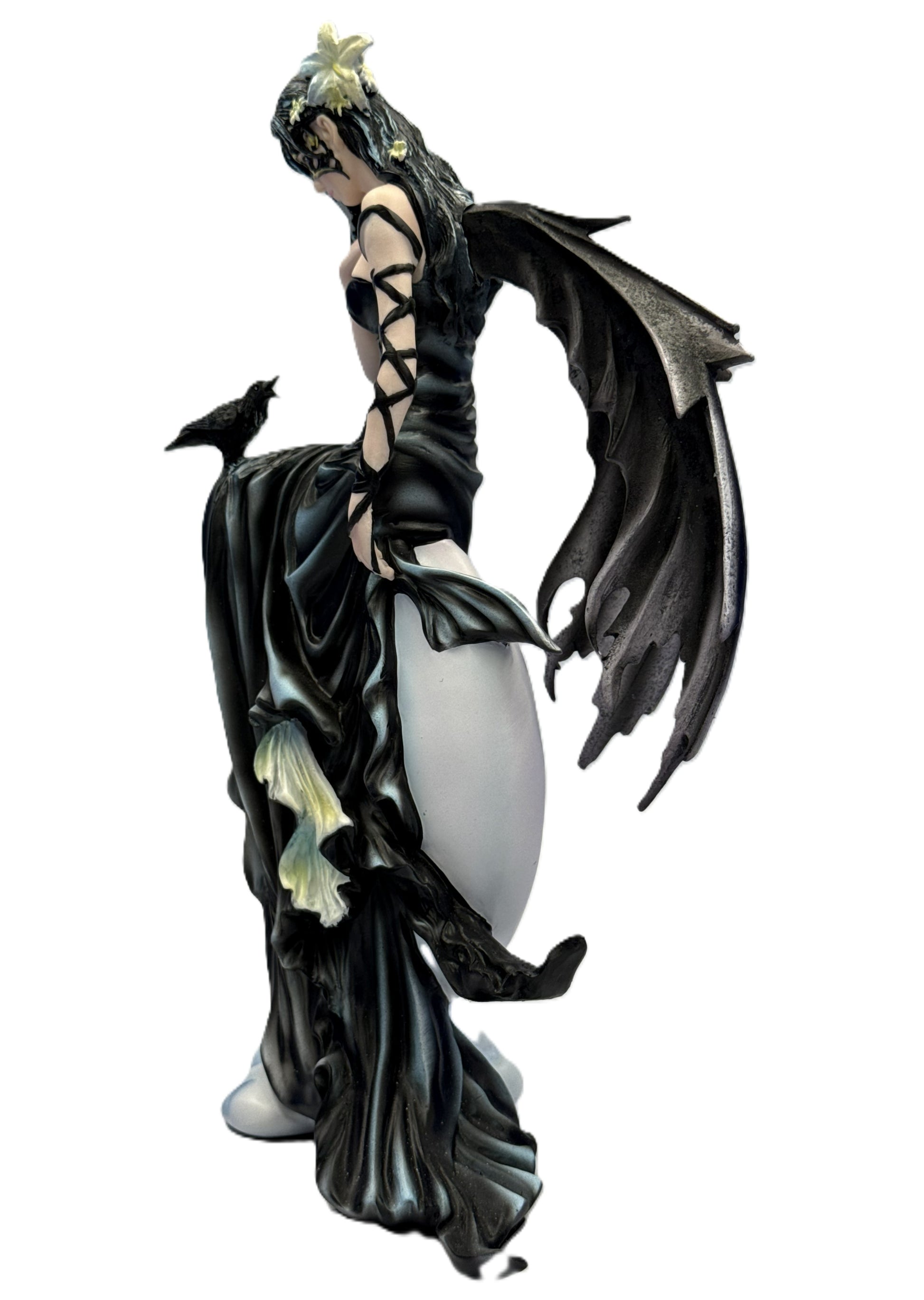 Left side view of gothic fairy statue showing detailed wings, flowing dress, and perched raven companion
