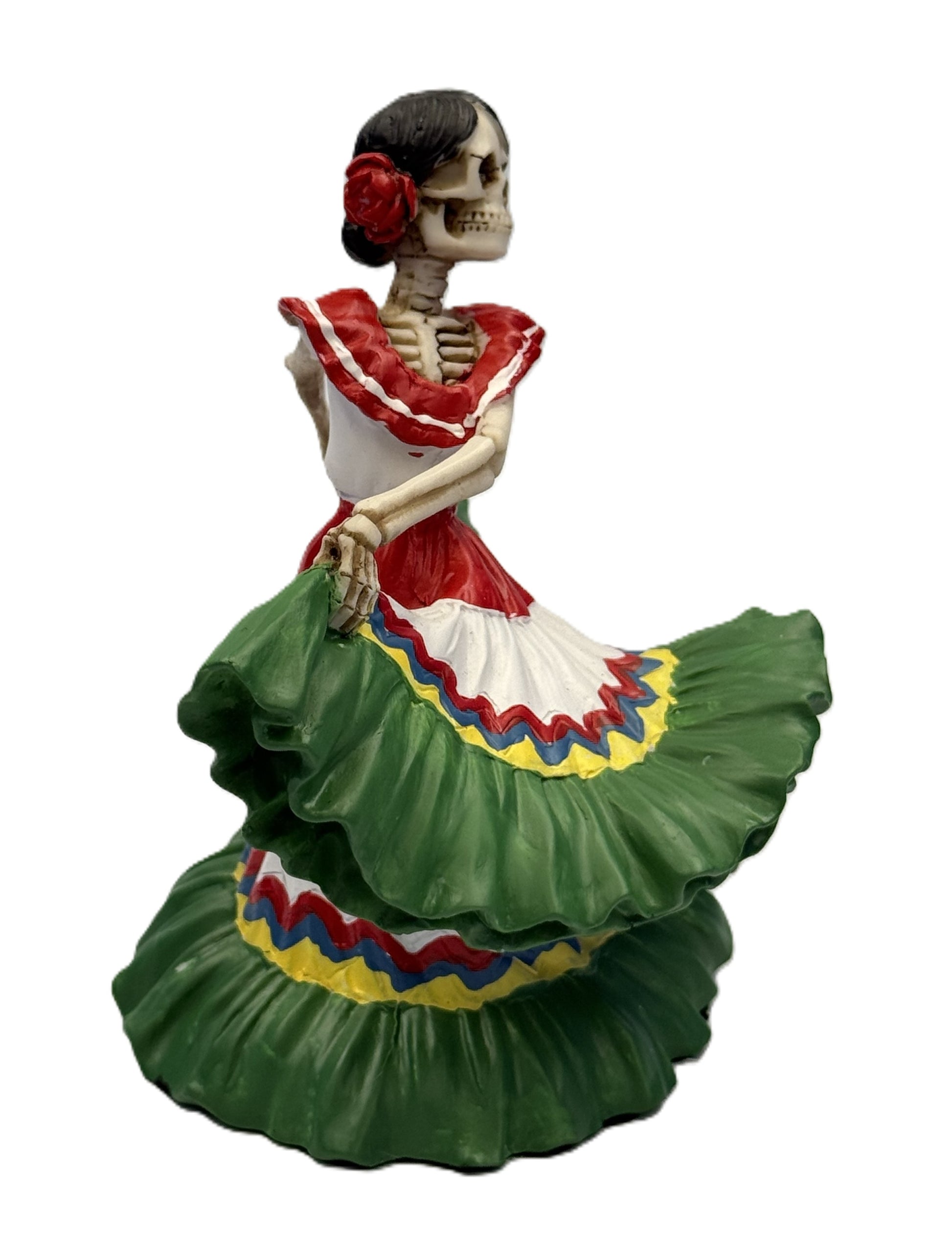 Angled view of dancing skeleton señorita statue with colorful layered skirt and dynamic pose resin
