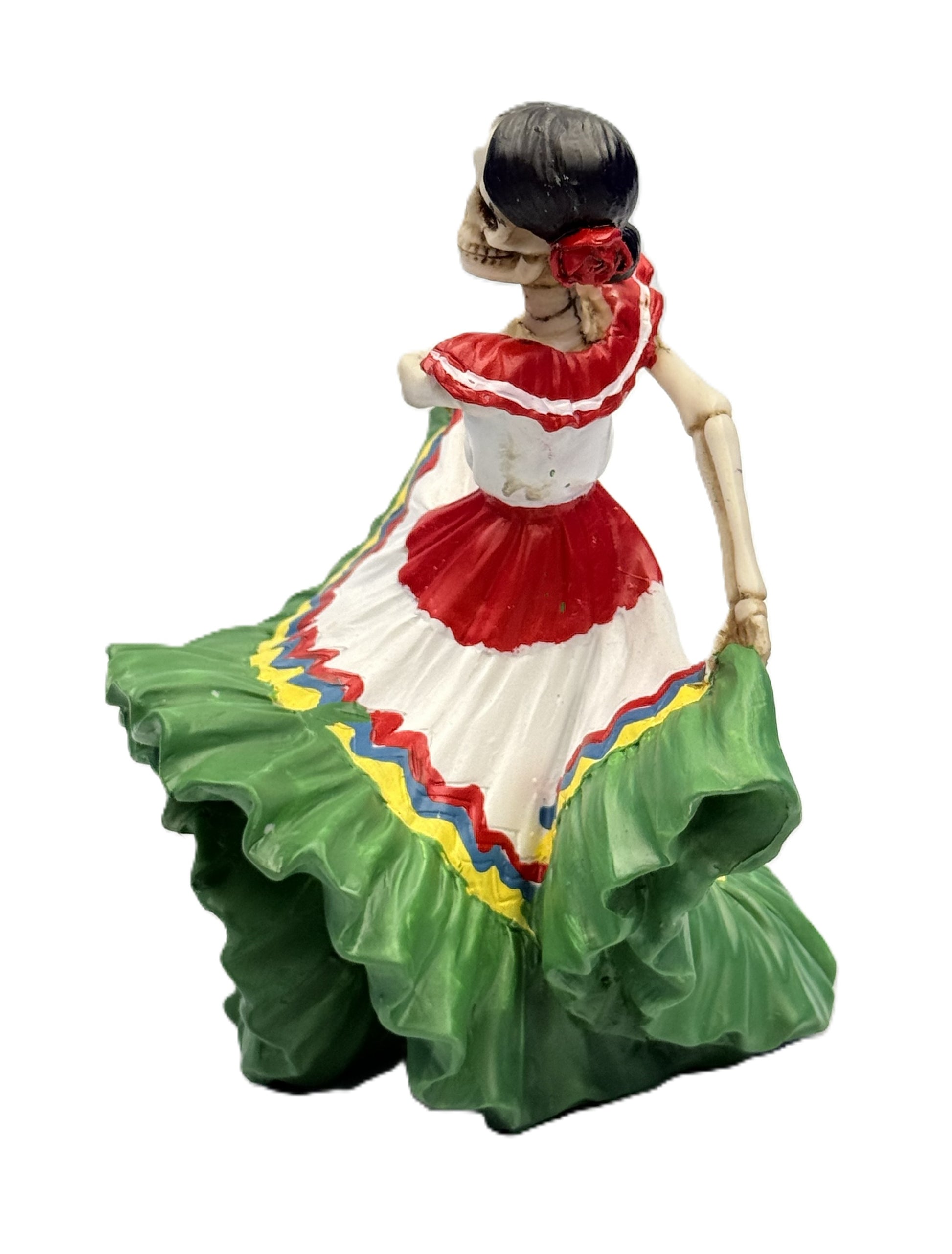 Side view of skeleton señorita dancer figurine with flowing green dress and floral hair detail resin statue
