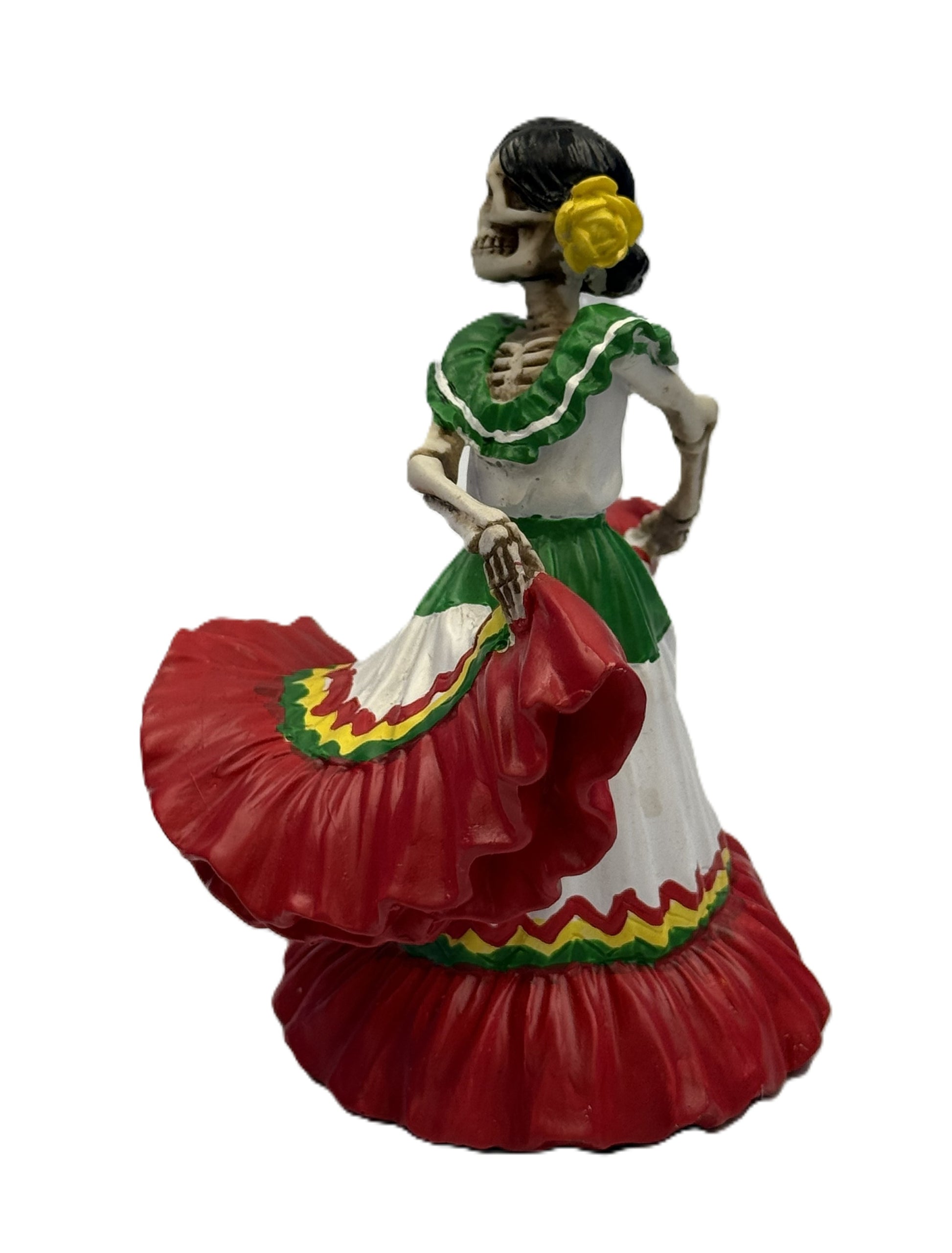 Side view of skeleton señorita dancer figurine with flowing red dress and floral hair details resin statue
