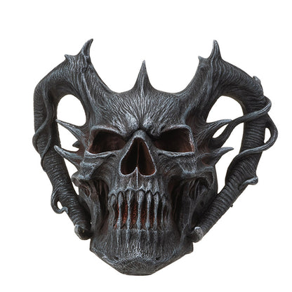 Front view of horned demon skull with sharp details and dark finish
