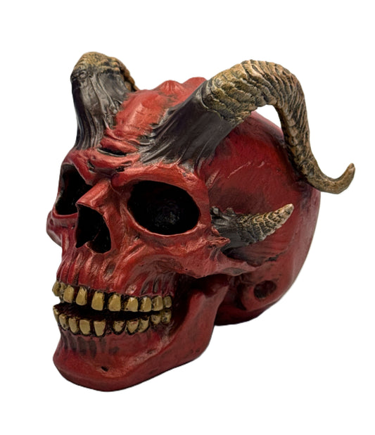 Front left angled view of red demon skull statue with curved horns and detailed teeth in gothic style
