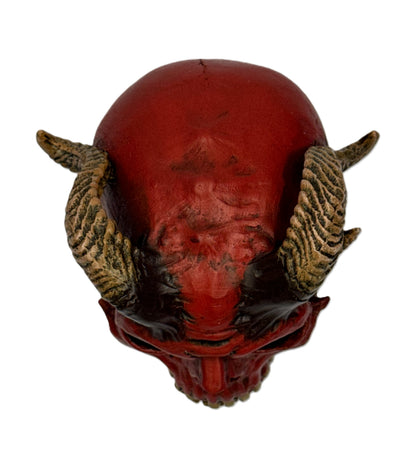 Top view of demon skull decor highlighting horn placement and sculpted ridges on the skull surface
