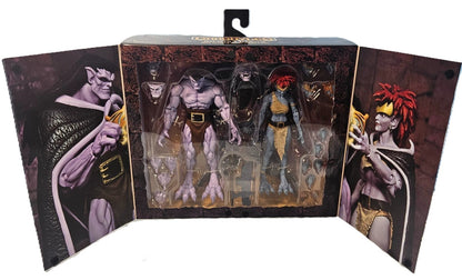 Opened display packaging for Disney Gargoyles Goliath and Demona Ultimate action figure set with accessories visible
