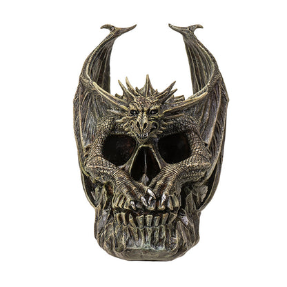 Front view of dragon perched on skull with wings extended and detailed sculpting
