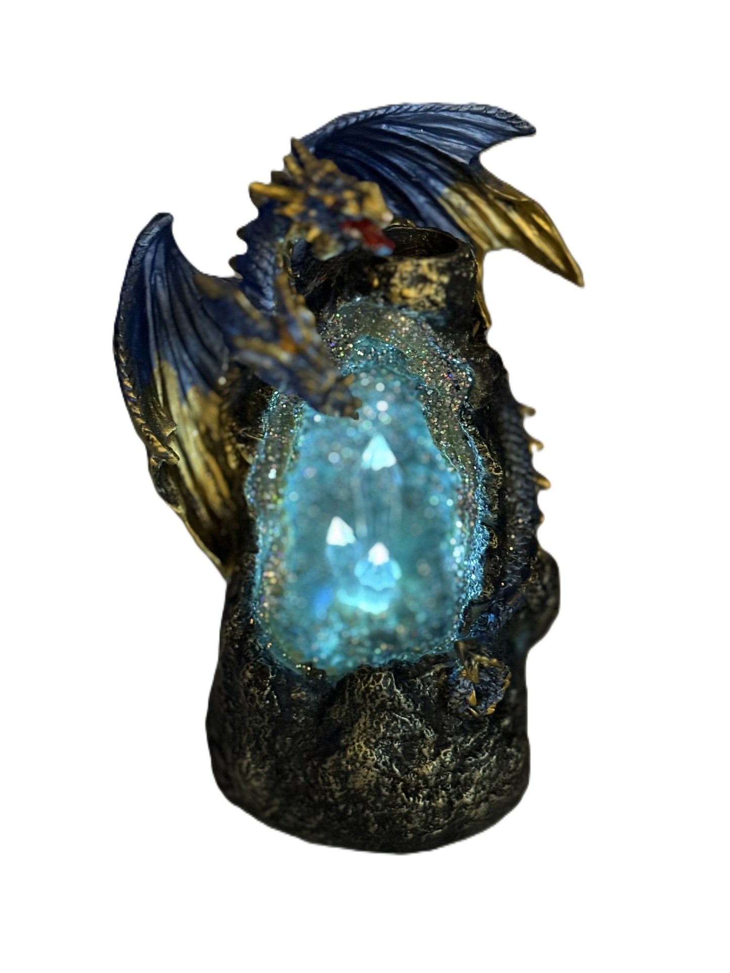 Dragon incense burner glowing with blue LED light illuminating crystal cave

