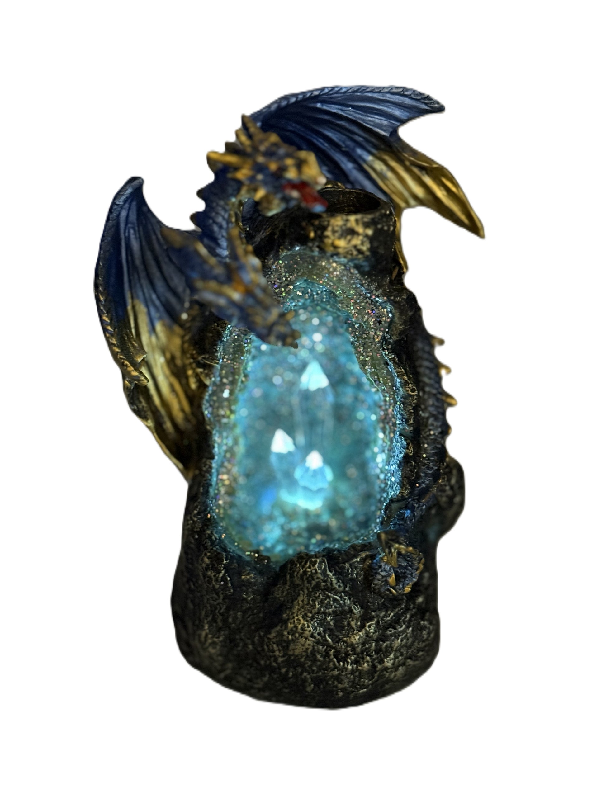 Dragon incense burner glowing with blue LED light illuminating crystal cave
