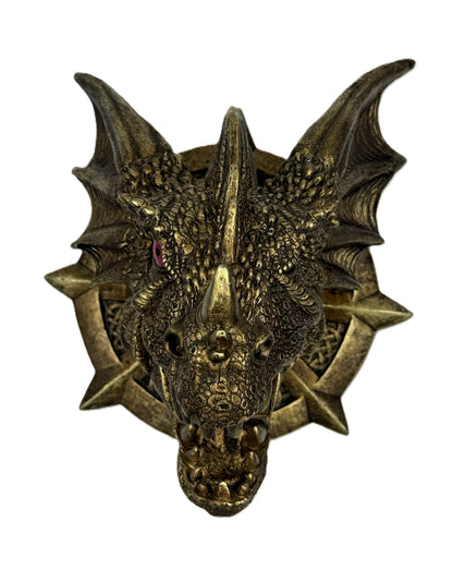 Bronze dragon head sculpture on a white background