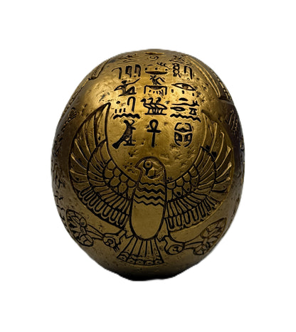 Back view of Egyptian skull decor with Horus falcon engraving and ancient Egyptian hieroglyph patterns
