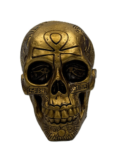 Front view of Egyptian skull statue with ankh symbol on forehead and carved hieroglyph accents
