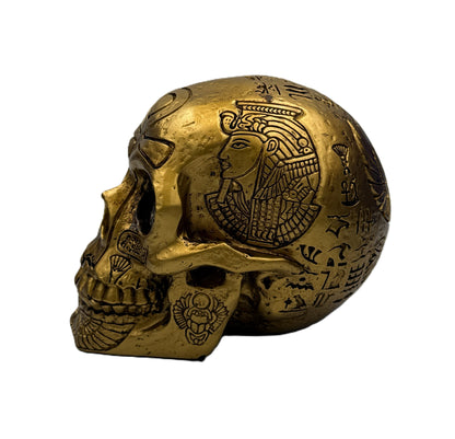 Side view of Egyptian skull statue featuring pharaoh profile carving and intricate hieroglyphic symbols
