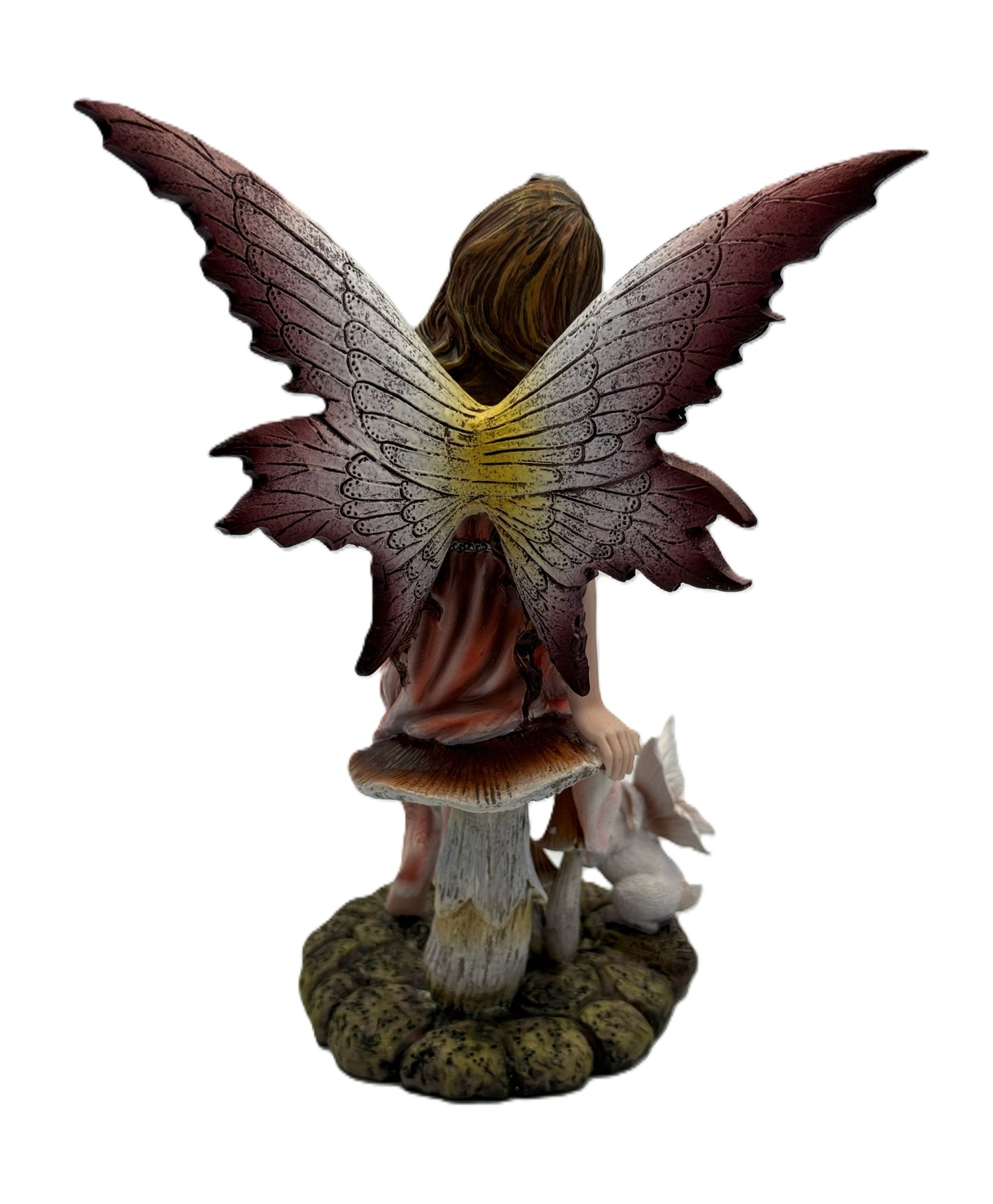 Back view of fairy statue highlighting large textured wings and woodland base with rabbit figure
