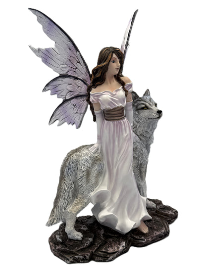 Angled front view of fairy figurine with wolf showing hand-painted details and fantasy styling
