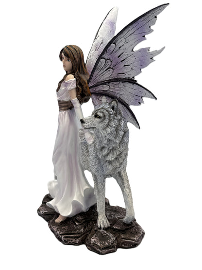 Side angle of fairy and wolf sculpture highlighting textured wings and realistic wolf details
